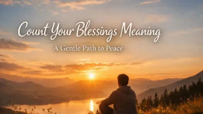 person sitting on hill at sunset reflecting on life, count your blessings meaning and peaceful gratitude moment